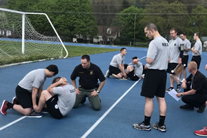 police academy students exercising on the track
