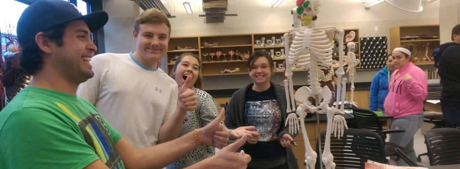 students in classroom with skeleton