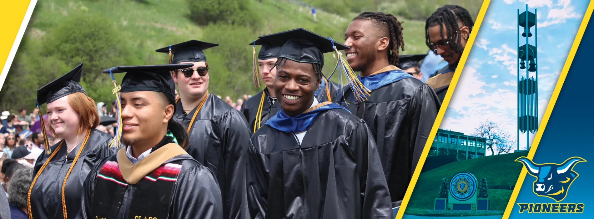 smiling grads in black caps and gowns