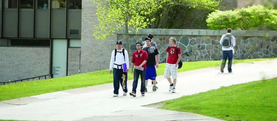 students walking down the center of campus