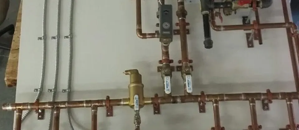 pipes and wiring on a board