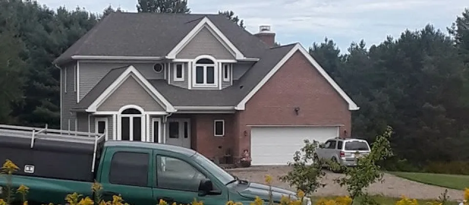 house with truck in front of it