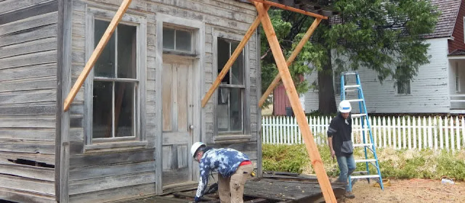 students repairing a porch