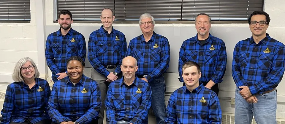 staff members wearing blue and black shirts