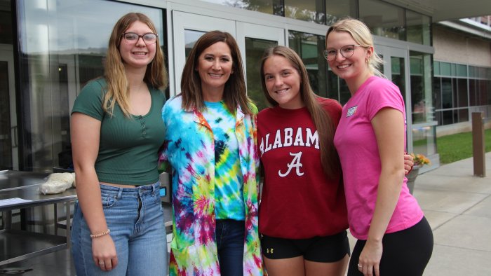 Students pose with faculty during first week of classes.