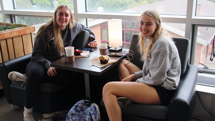 Students relaxing with a coffee at SLC.