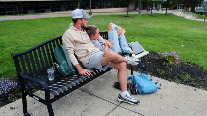 Students relaxing enjoying the nice weather on campus.