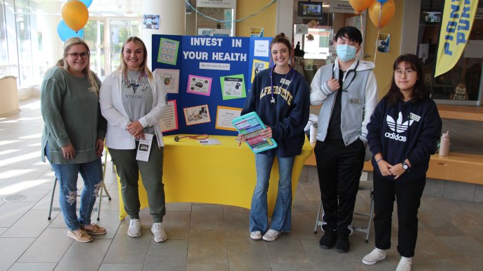Nursing students sharing useful health resource information.
