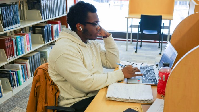 Student studying in Hinkle Library