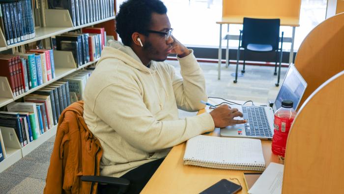 Student studying in Hinkle Library