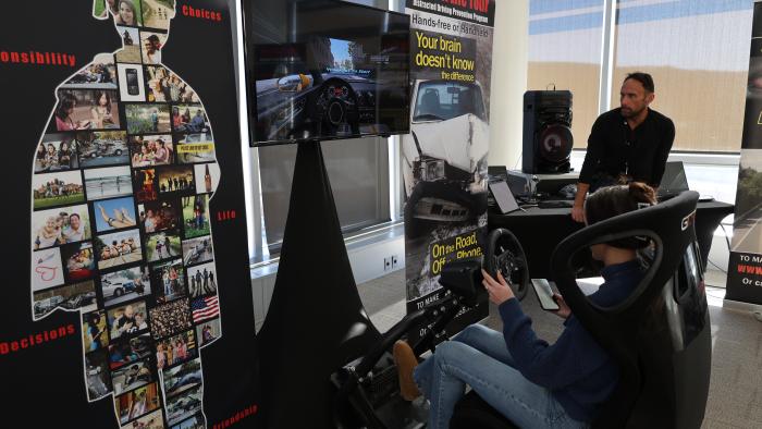 Student tries a distracted driving simlulator