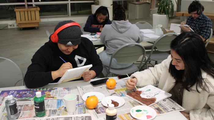 Students paint canvases
