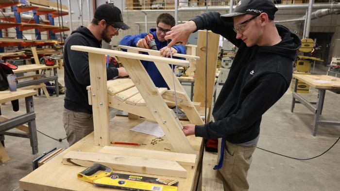 Students building a chair