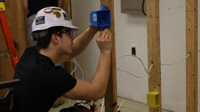 Student works on Electrical practical.