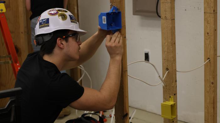 Student works on Electrical practical.