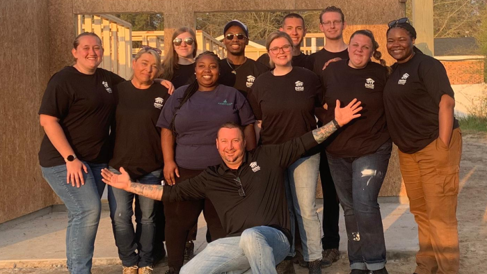 Alfred State students help build a house.