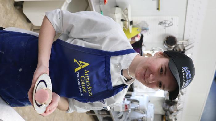 Students shows off culinary creation