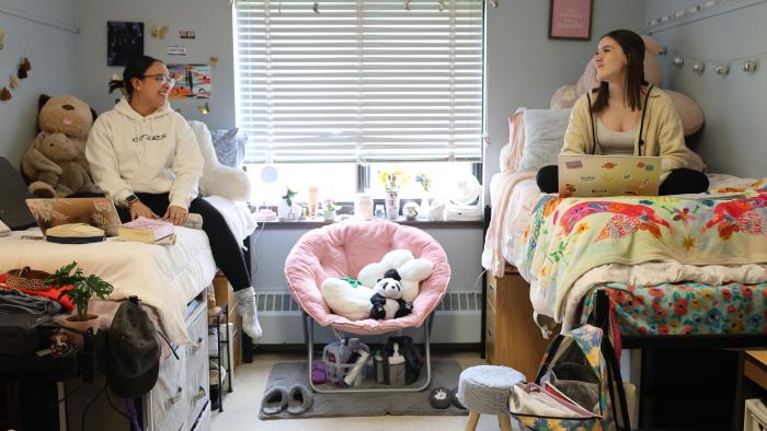 Two female students in their dorm room
