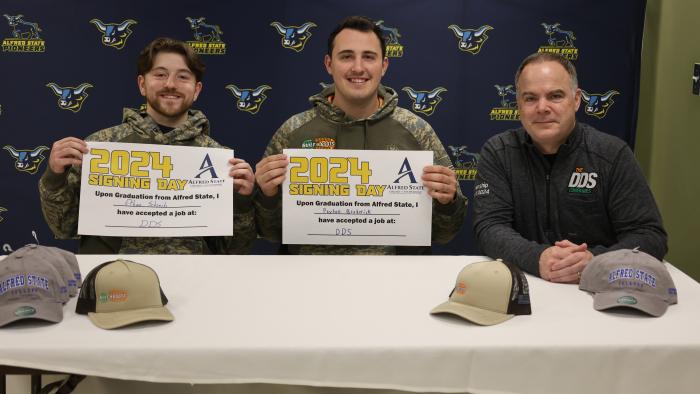 Students pose wit their new employer