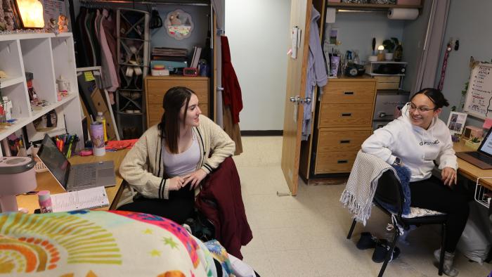 Female students relaxing in their dorm room