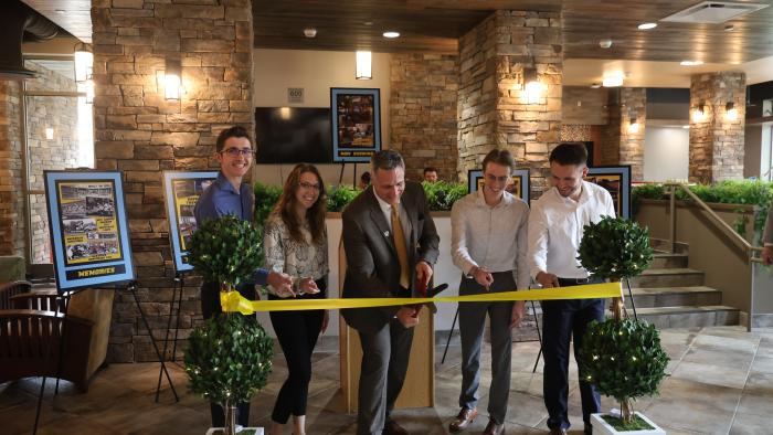 Dr. Mauro cuts ribbon at MacKenzie Commons