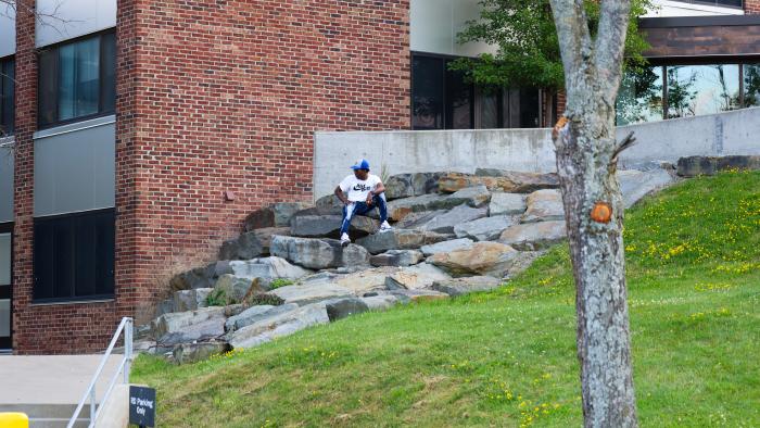 Students enjoying a sunny day outside MacKenzie complex