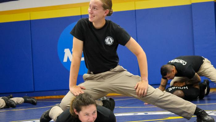 Police Academy Cadet practices ground control techniques.