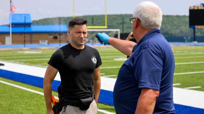 Police Academy cadet gets sprayed with pepper spray.
