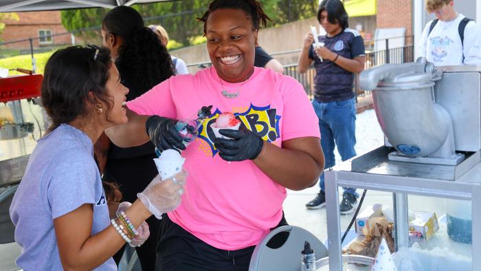 Students serve snow-cones 