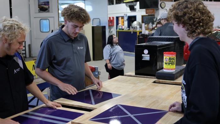 Autobody students work on a project