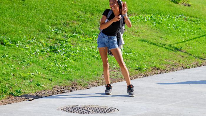Female student enjoying warm weather