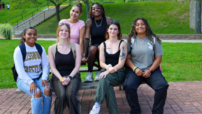Group of female students enjoying fall weather on campus
