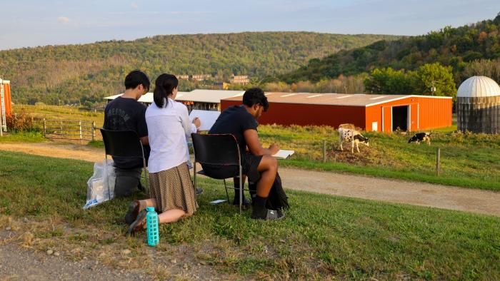 Students draw landscapes at the Alfred State Farm.