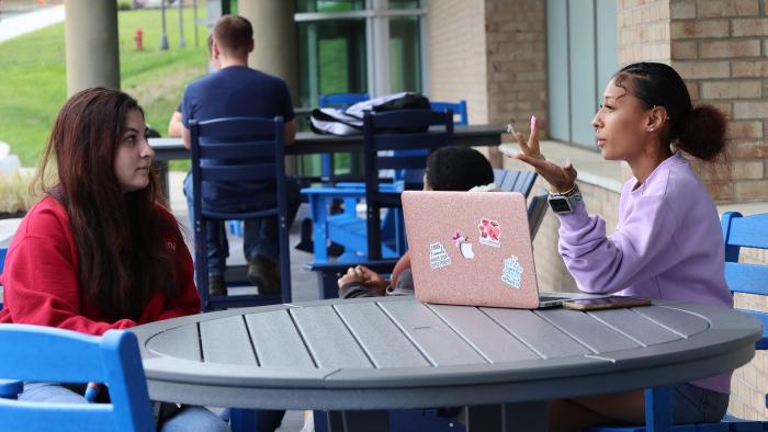 Students enjoying new seating outside CDH