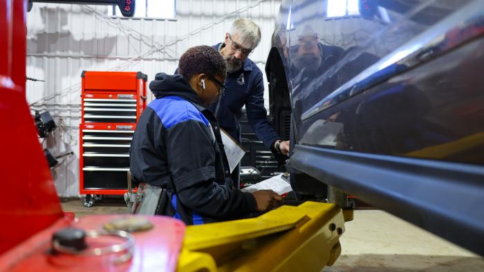 Student receives guidance from Auto professor