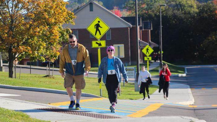 Participants walking in homecoming 5k