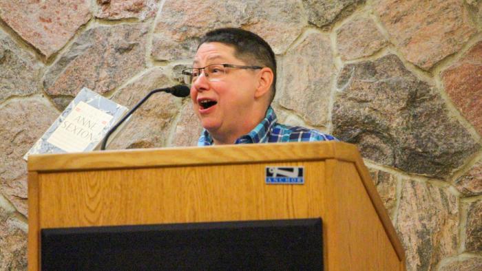 Faculty reads a poem 