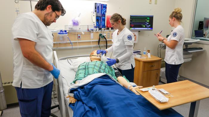 Nursing students working in hands-on lab