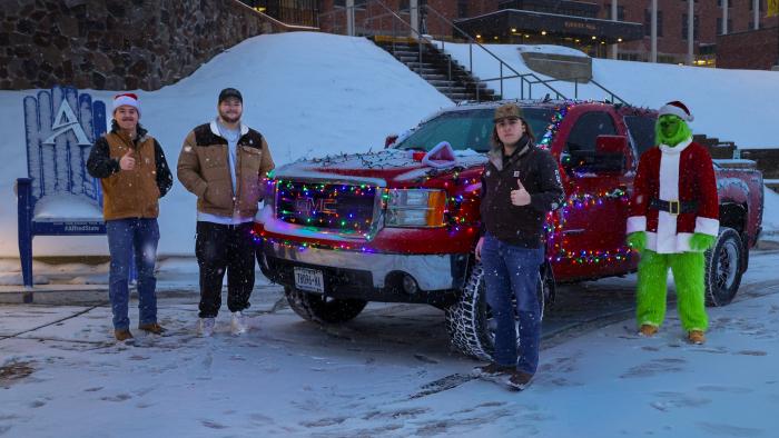 Alfred State students pose with their festive truck