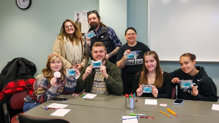 Intercultural Communications students show off their gift from the Humphrey Fellows