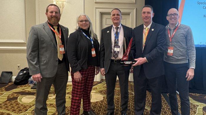 Dr. Mauro and Jason Doviak accept NADIIIAA award.