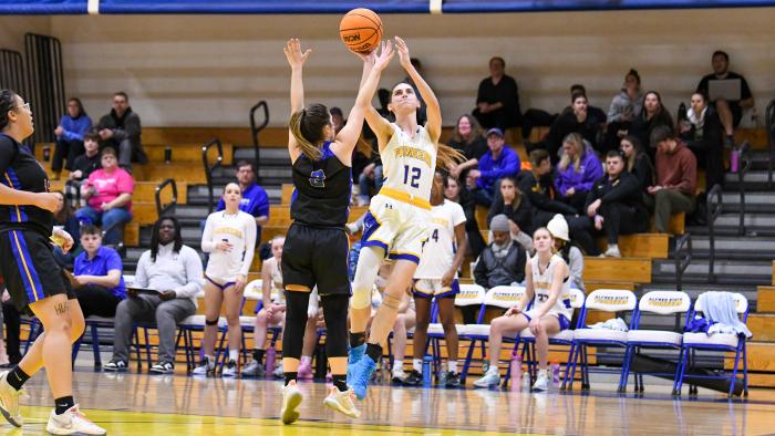 Jenna George (12) takes a shot against Pitt-Bradford.