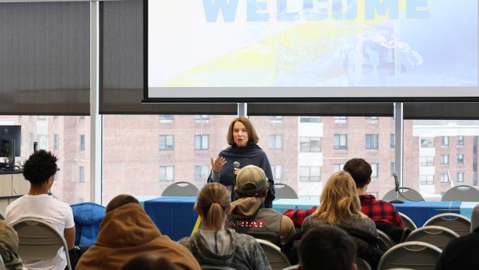 Carrie Cokely addresses new students.