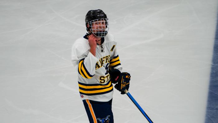 Alfred State hockey player smiles for the camera
