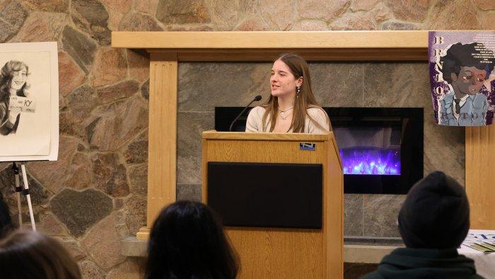 Student Madigan Harris recites a poem