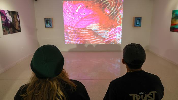 Students visit a guest exhibit in Llewellyn Gallery