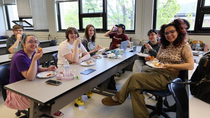 Students enjoying some pizza and energy drinks for Finals prep