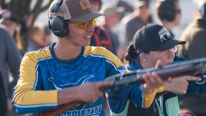 Member of Alfred State Trap team lines up a shot