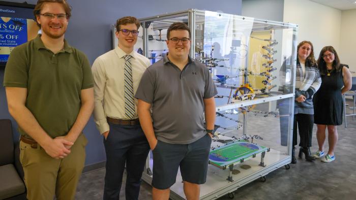 Senior Engineering students with their Rube Goldberg Machine