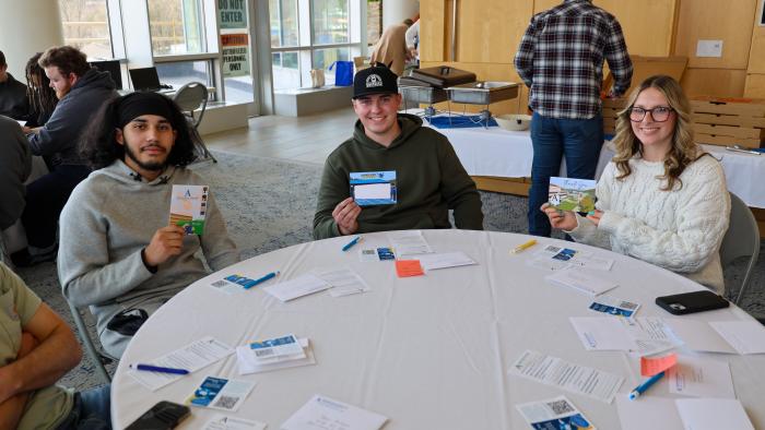 Students filling out thank you cards for scholarships